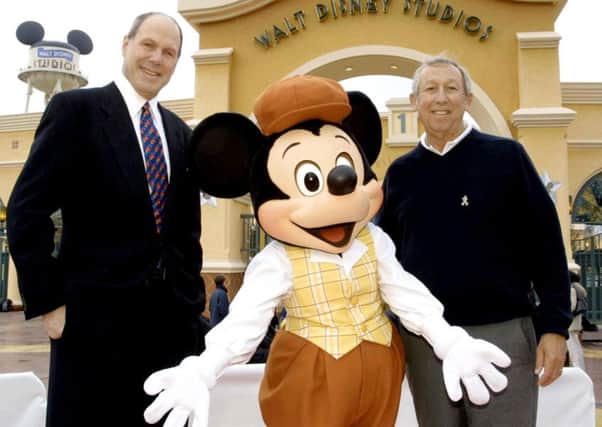 Michael Eisner (left) with Roy Disney by the entrance to the Walt Disney Studios Park.