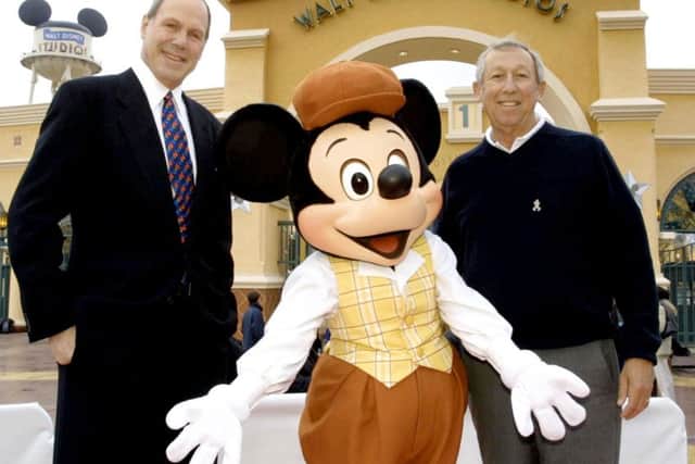 Michael Eisner (left) with Roy Disney by the entrance to the Walt Disney Studios Park.