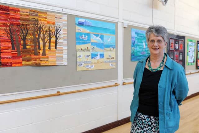 Ann Bartlett next some of Maureen Thomas's work. Picture: Sarah Standing (170407-4519)