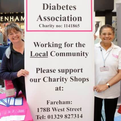 Shops manager Gayle Nash, left, and director Chris Edwards of The Solent Diabetes Association in Fareham and Gosport.Picture: Sarah Standing (170409-4642)