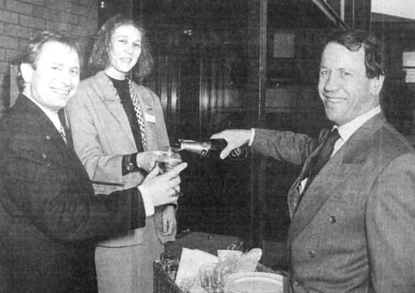 Trying the champagne were new residents Clive Norris, a print buyer for NM Financial management, banking secretary Sarah Gillespie, and Peter Crowther, managing director of Acorn Business Centres Ltd (B6388-1)