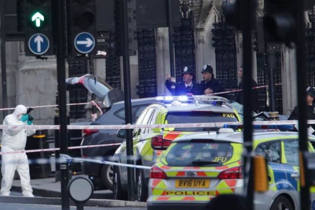 Police forensic officers close to the Palace of Westminster, London, after an attack earlier today. Picture: Yui Mok/PA Wire