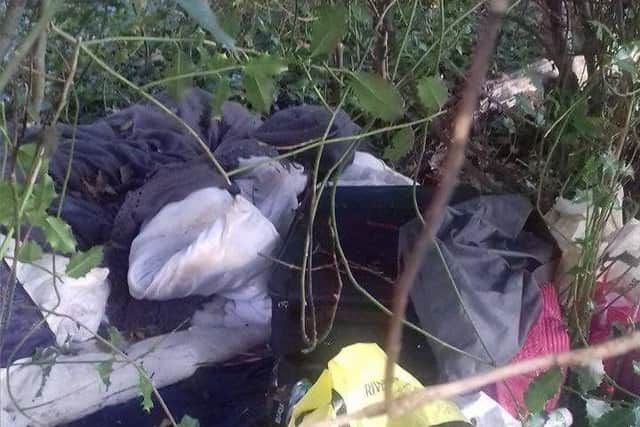 People are being encouraged to recycle old clothes instead of throwing them away