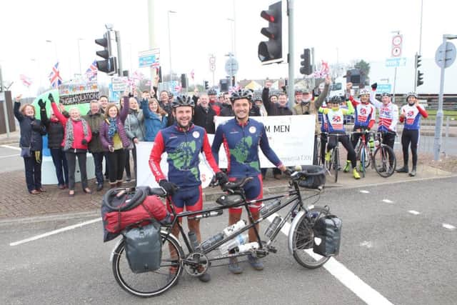 The Tandem Men George Agate, left, and John Whybrow greeted by friends, family and members of Portsmouth North End Cycle Club just outside the city's ferry port. 
Picture: Habibur Rahman