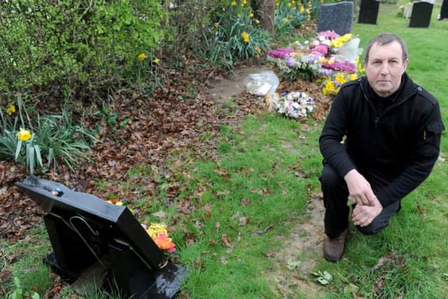 Colin Cleverley at his daughter Samantha's grave. Behind is the plot he thought he'd bought 

Picture: Sarah Standing (170413-4800)