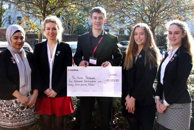 From left, deputy head girl Sayeeda Nur, Head Girl, Genevieve Wilks, Justin Heath from The Haven, with deputy head girls Esther Pilling and Rosie Tredray