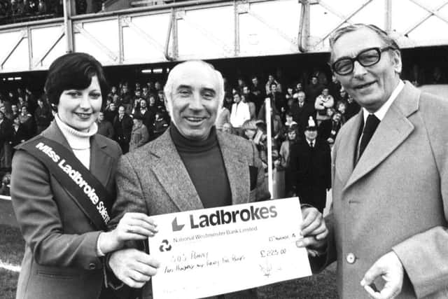 Retired bookmaker Harry Garcia, of North End , centre, at Fratton Park in November 1976