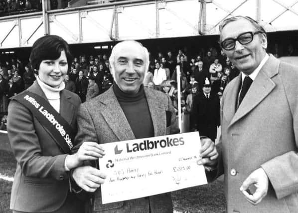 Retired bookmaker Harry Garcia, of North End , centre, at Fratton Park in November 1976