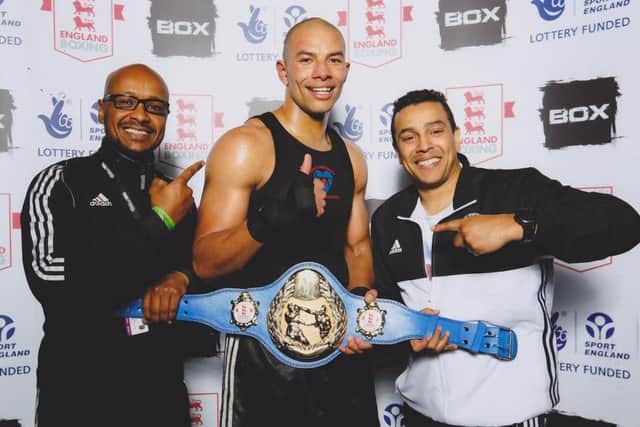 Greg Bridet, centre, has won the English Title belt