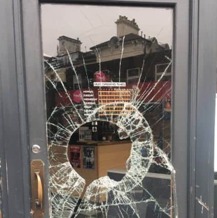 One of the windows damaged during a recent break-in at Huis