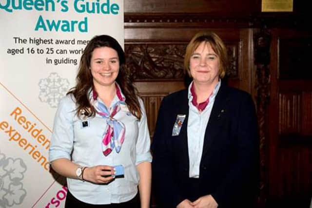 Abiee Harris, left, receives her award