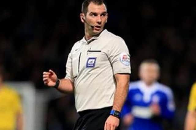 Referee Tim Robinson