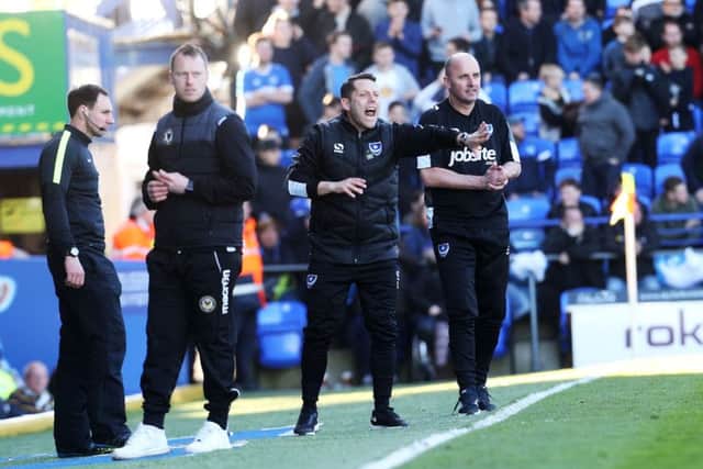 Pompey boss Paul Cook, right, at today's match against Newport. Picture: Joe Pepler