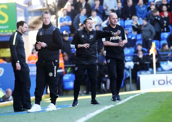 Pompey boss Paul Cook, right, at today's match against Newport. Picture: Joe Pepler