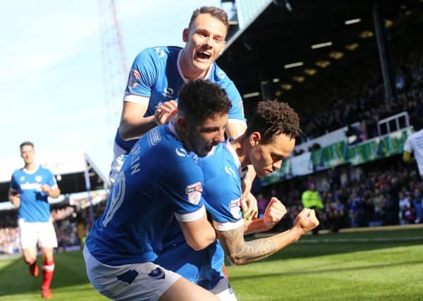 Kyle Bennett celebrates scoring his first goal of the match during Pompey's win against Newport County. Picture: Joe Pepler.
