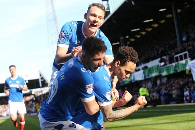 Kyle Bennett celebrates scoring his first goal of the match during Pompey's win against Newport County. Picture: Joe Pepler.