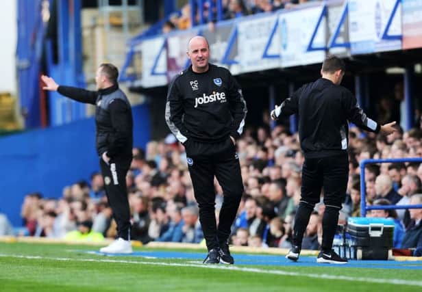 Paul Cook during his 100th game in charge of Pompey against Newport on Saturday. Picture: Joe Pepler