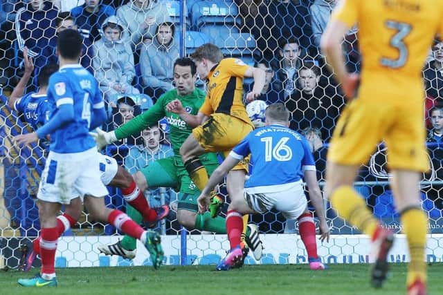 David Forde denies Alex Samuel during Saturday's game at Fratton Park Picture: Joe Pepler