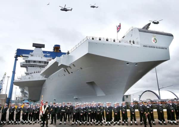 A helicopter flypast at the formal naming ceremony for HMS Queen Elizabeth in Rosyth Dockyard, Fife Picture: Andrew Milligan/PA Wire