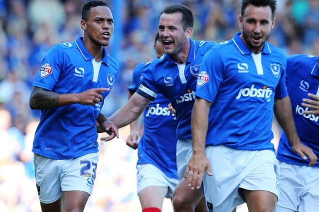 Paul Cook opened his Pompey account with a 3-0 home win against Dagenham & Redbridge on August 8, 2015. Kyle Bennett, left, scored two and set up the other for Gareth Evans in that victory