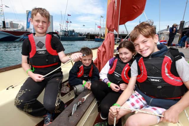 Sailors Ethan Roberts-Watts. 10, James Mulroy, eight, Abigail Mulroy, 12, and Rowan Clelland-Pryke, nine, prepare to sail out of Haslar Marina with an instructor during their sailing session this morning at Gosport Marine Festival in 2015. Picture: Matt Scott-Joynt