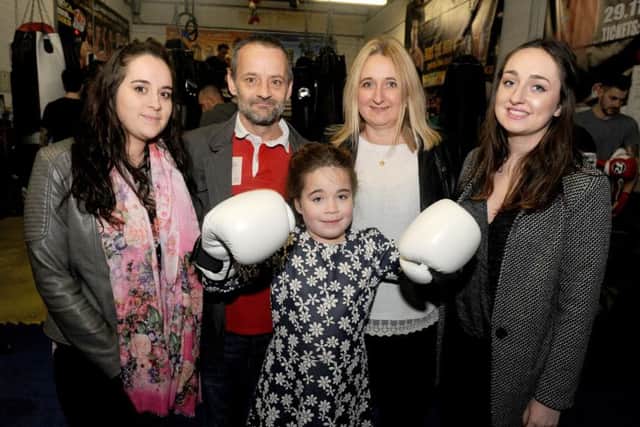 Pictured is: Maddison Crockford-Reid middle (nine) with her family (l-r) half sister Aimee Bastable (22), dad Spencer Crockford (43), mum Shelly Reid (44) and half sister Jorden Evans (20).Picture: Sarah Standing (160167-1591) PPP-160202-174714001