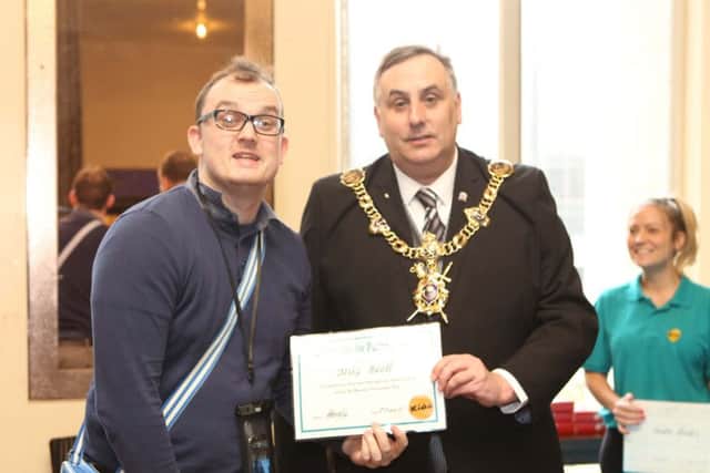 Cllr Fuller awards a certificate of achievement to Mike Beall