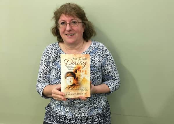 Karen Stocker with her book called My Dear Daisy