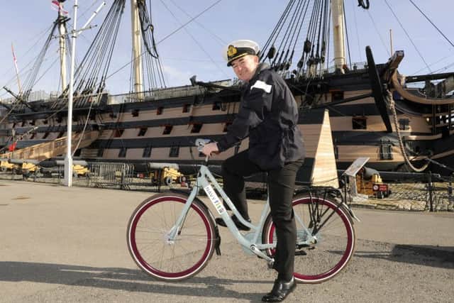 Commodore Jeremy Rigby on one of the new 'Boris bikes' at Portsmouth Naval Base Picture:  Malcolm Wells (170313-7879)