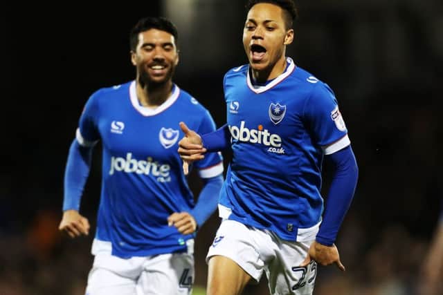 Kyle Bennett celebrates scoring against Grimsby as Danny Rose gives chase
