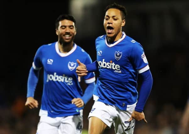 Kyle Bennett celebrates scoring against Grimsby as Danny Rose gives chase