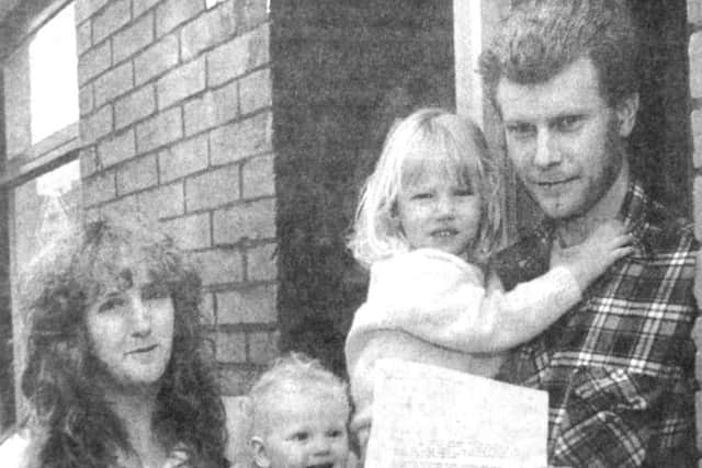 Peter Elliot, with his wife Nicky and children Kirstie and Jennifer, holding the letter from Mike Hancock (B4612-1) PPP-170330-150758001