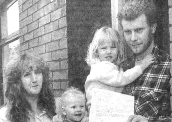 Peter Elliot, with his wife Nicky and children Kirstie and Jennifer, holding the letter from Mike Hancock (B4612-1) PPP-170330-150758001