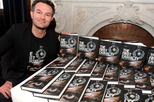 Author Ricky D Phillips with copies of his new book The First Casualty - The Untold Story of the Falklands War