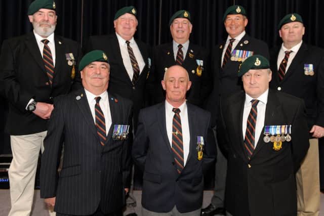 Veterans at the launch of the book at the Royal Marines Museum.  Pictured are: (Back, l-r) Michael Reynolds, David Gerrard, Graham Evans, Ray Bloye and Marc Branch with (front, l-r) Nick Williams, Murdo Macleod and Mark Gibbs.   Picture: Sarah Standing (170451-5007)