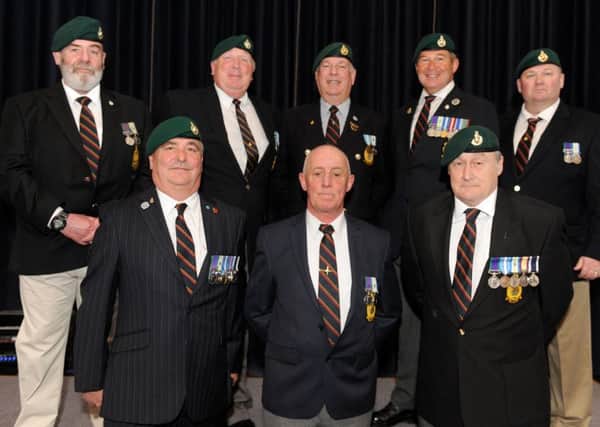Veterans at the launch of the book at the Royal Marines Museum.  Pictured are: (Back, l-r) Michael Reynolds, David Gerrard, Graham Evans, Ray Bloye and Marc Branch with (front, l-r) Nick Williams, Murdo Macleod and Mark Gibbs.   Picture: Sarah Standing (170451-5007)