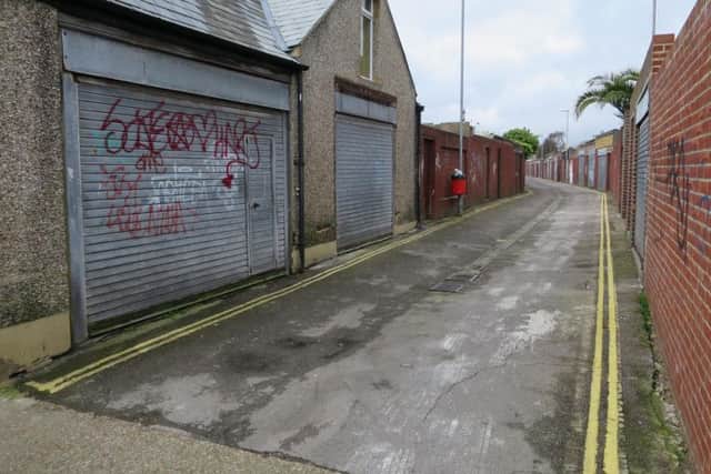 Police had closed the alleyway between Talbot Road and Fawcett Road