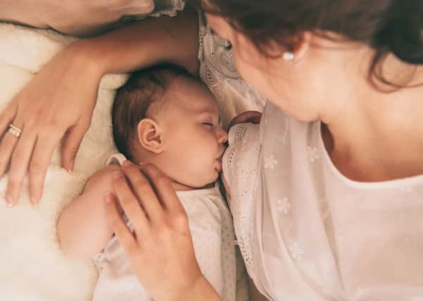 A Generic Photo of a young baby being breast fed by their mother. See PA Feature FAMILY Breastfeeding. Picture credit should read: PA Photo/thinkstockphotos. WARNING: This picture must only be used to accompany PA Feature FAMILY Breastfeeding. FAMILY_Breastfeeding_103679.JPG