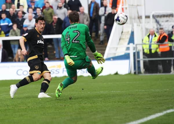 Gary Roberts scores Pompey's second against Hartlepool. Picture: Joe Pepler/