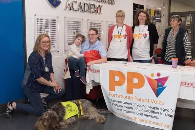 Left to right: Lynne Ann-Rigby from Pets as Therapy with Arty, Emily King, 10 with Carys Bibby, Alison Cooper, Barbara McDougal at the support day in Portsmouth. Photo: Keith Woodland. 170424