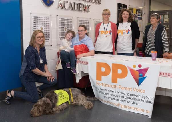 Left to right: Lynne Ann-Rigby from Pets as Therapy with Arty, Emily King, 10 with Carys Bibby, Alison Cooper, Barbara McDougal at the support day in Portsmouth.  Photo: Keith Woodland. 170424