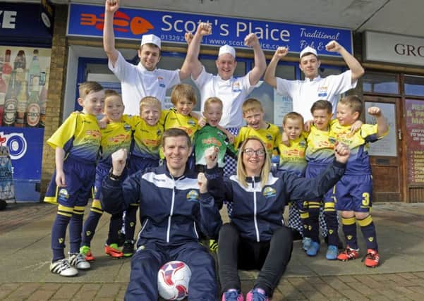 A new under 7's youth football team has been sponsored by Scotts Plaice fish and chip shop in Gosport. (left to right back), Steve King, Scott Turner, Josh Noyce. The team (left to right), Preston Griffiths, Harvey Thompson, Michael Wallin, George Sterling, Reggie Batten, Mason Mancell, Tommy Cole, Frankie White, Tyler Barrett. with front, the coaches John Walin and Carla Gillard.  Photo Ian Hargreaves  (170341-1) PPP-170204-114327006