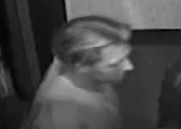 CCTV of a man police want to speak to after an assault at the Slug and Lettuce