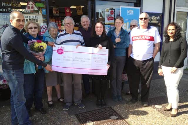 The donation from Nisa to St Nicholas Church
