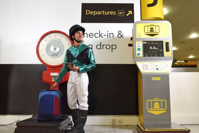 To celebrate 100 years since Gatwick Racecourse hosted the 1917 Grand National, Gatwick Airport has installed authentic jockey scales in the South Terminal. The jockey pictured is wearing traditional silks in Gatwick colours