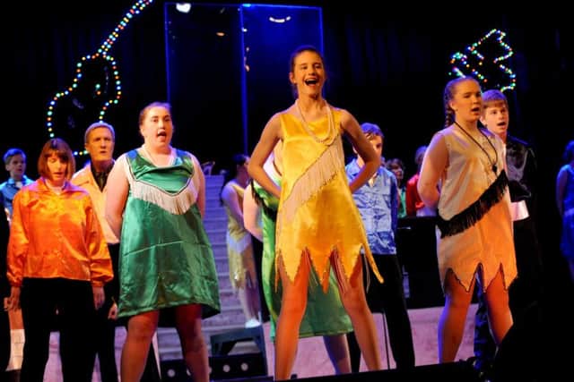 Gosport Scout Ellie Searle, centre, during last year's Gang Show  Picture: Sarah Standing (160601-897)
