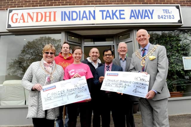 The Mayoress of Fareham Anne Ford, David Bell, Hayley Callacher, from Cancer Research UK, Paul Richards from Richards Newsagent, owner of Gandhis Abu-Suyeb Tanzam, Cllr Leslie Keeble and the Mayor of Fareham Mike Ford with fundraising cheques from last years curry night