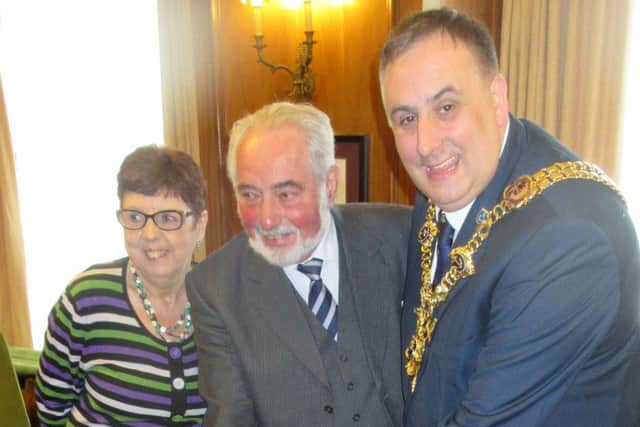Cllr David Fuller, the Lord Mayor of Portsmouth, Alex Bentley and Nicke Bentley, cutting the celebratory charity cake for the Bentley Young Person's Trust