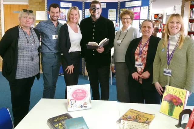 Gosport MP Caroline Dinenage, third from left, with costumed Sean Blackman, middle, and members of Project 365 and We Can Read at Elson Library