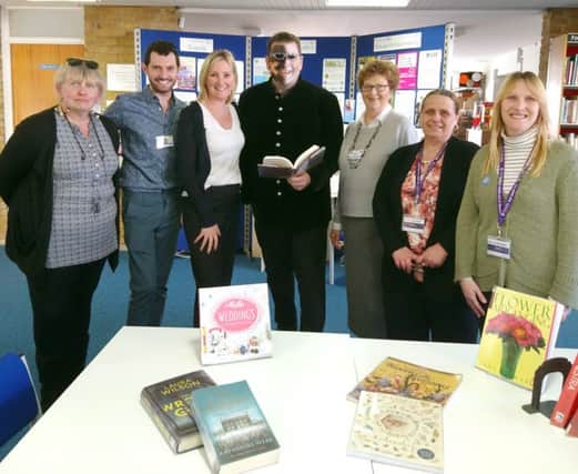 Gosport MP Caroline Dinenage, third from left, with costumed Sean Blackman, middle, and members of Project 365 and We Can Read at Elson Library